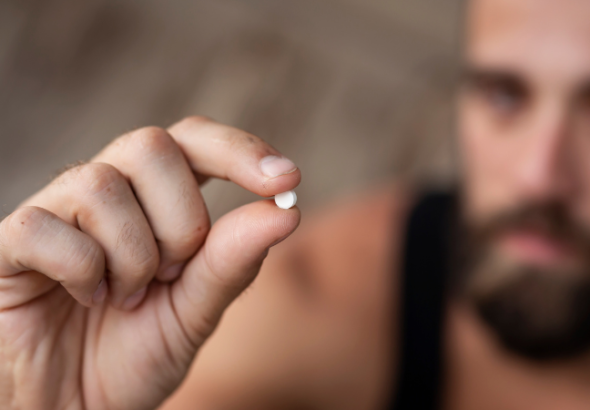 ecstasy-addiction-man-with-pill